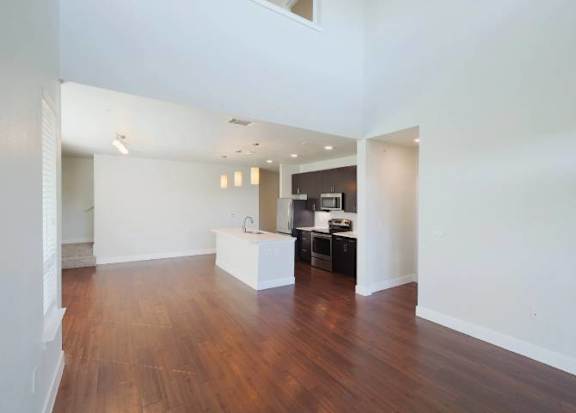 A kitchen area with a sink and a counter.