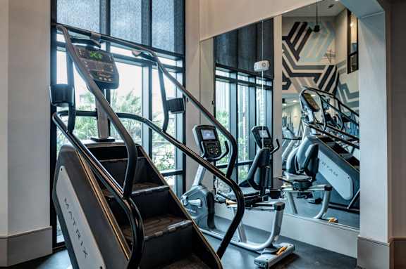 Gym with treadmills and exercise bikes at Caldwell, Houston, 77084