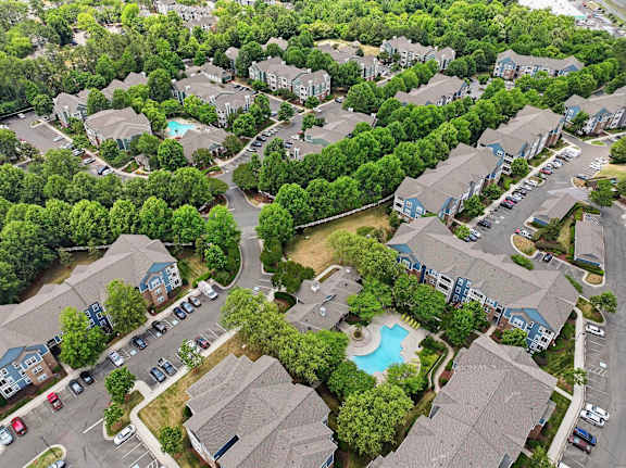 Aerial view of apartment community with pool and parking at Alden Place at South Square Apartments, Durham, North Carolina