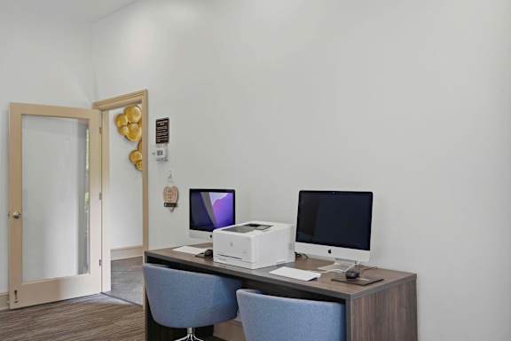 Business center with computers and office equipment at Alden Place at South Square Apartments, Durham, NC