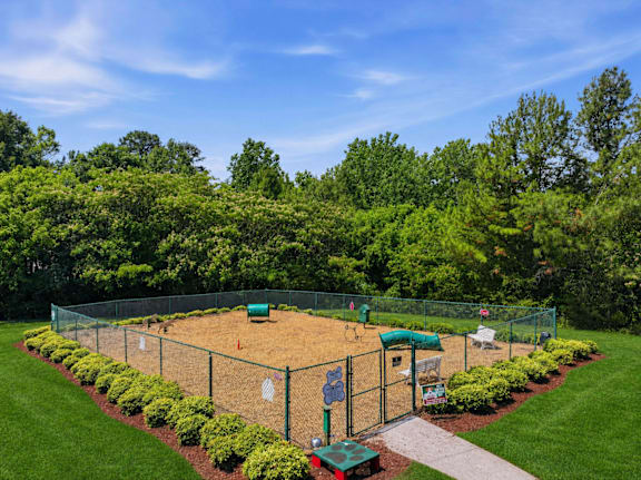 Fenced dog park with agility equipment and green space at Alden Place at South Square Apartments, North Carolina, 27707