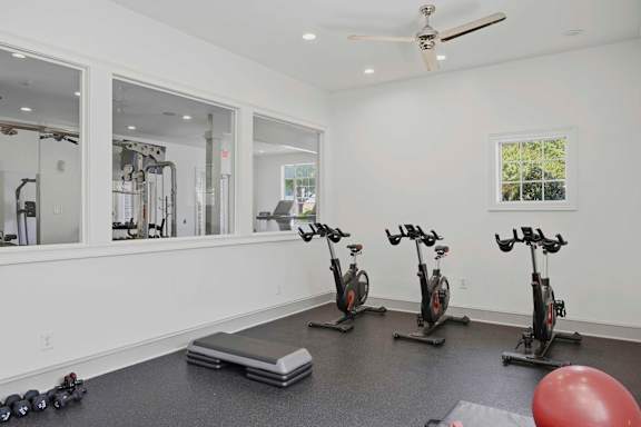Fitness center with stationary bikes and exercise equipment at Alden Place at South Square Apartments, Durham, NC 27707