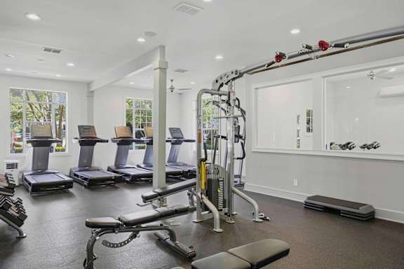 Fitness center with treadmills and cable machine at Alden Place at South Square Apartments, Durham, 27707