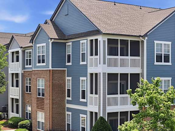 Three story apartment buildings with screened porches at Alden Place at South Square Apartments, North Carolina, 27707