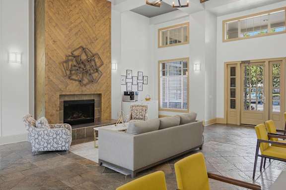 Clubhouse lobby with fireplace and high ceilings at Alden Place at South Square Apartments, Durham