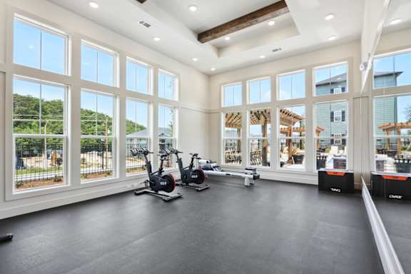 A spacious room with a treadmill and exercise bike. at Arcadia Cartersville Apartments, Cartersville
