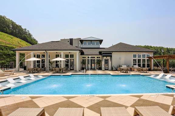 A large house with a pool in front at Arcadia Cartersville Apartments, Cartersville, 30121