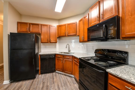 Kitchen With Black Appliances at Reserve Bartram Springs, Jacksonville, FL