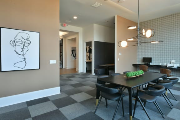 a dining room with a table and chairs