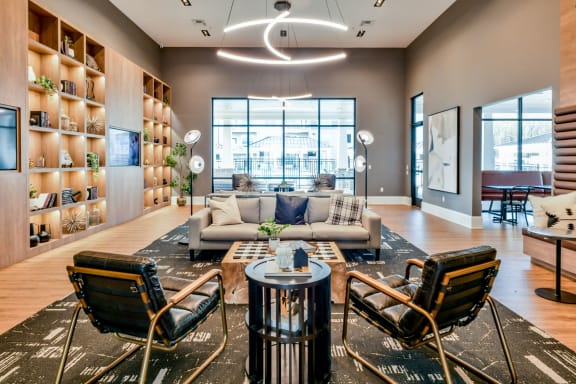 a living room with a couch and chairs and a table