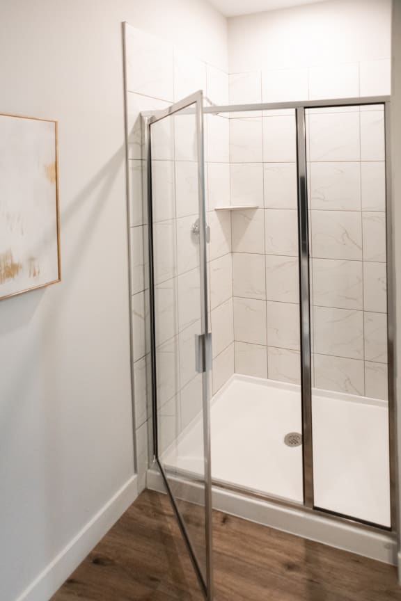a shower with a glass door in a bathroom  at City Place, Memphis