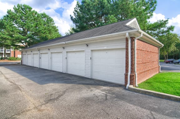 A two-car garage with a brick pillar at Enclave at Wolfchase Apartments, Tennessee 38016