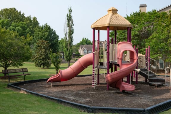 a playground with a pink slide and a wooden gazebo at Appling Lakes, Cordova, TN, 38016