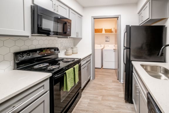 Kitchen with white cabinets at 1900 Rosemont, Roswell, Georgia