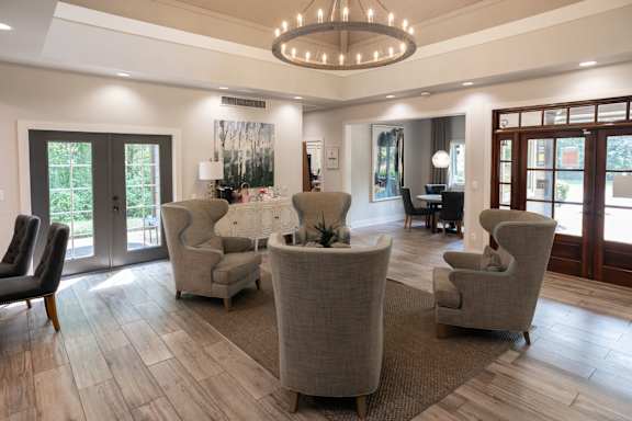 Living room with couches and chairs and a chandelier at 1900 Rosemont, Roswell, 30076