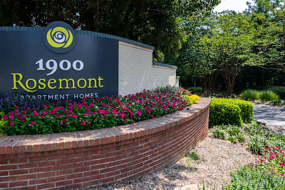 a brick retaining wall with a sign for rosenmont apartment homes at 1900 Rosemont, Roswell, 30076