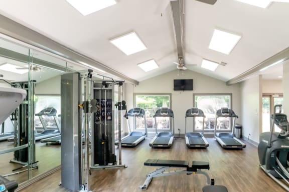 Gym with treadmills and other exercise equipment and windows at 1900 Rosemont, Roswell, 30076