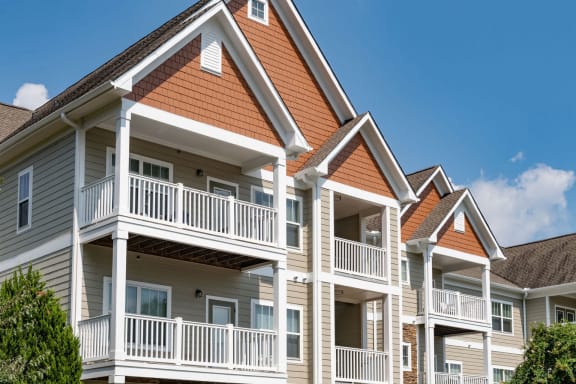 Bright Apartment Home Exteriors with Trees Inviting You Inside at Ashby at Ross Bridge, Hoover, AL 35226