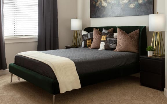 a bedroom with a bed and pillows&#xA0;at Esplanade District Apartments, Little Rock, AR,72114