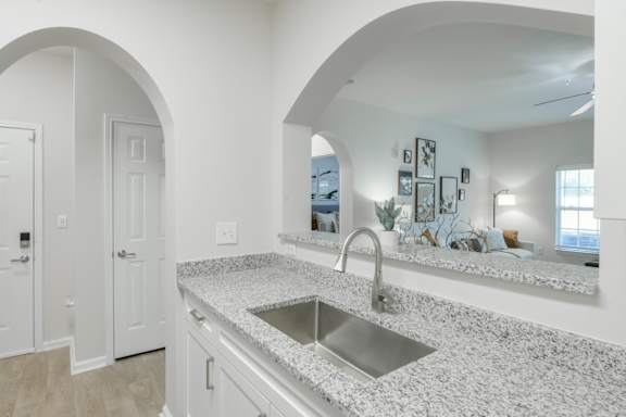 A kitchen with a sink and a countertop. at Henley at Mirror Lake, Villa Rica, 30180