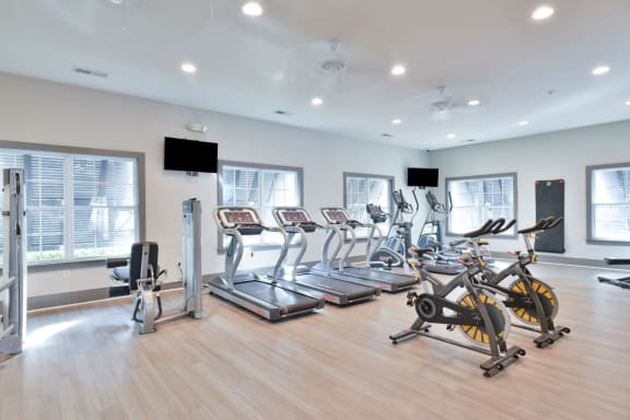 a gym full of cardio equipment and exercise bikes at Legends at Chatham, Savannah, GA
