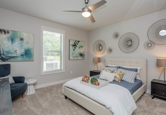 a bedroom with a bed and a ceiling fan at The McKenzie Park Apartments, Little Rock, 72223