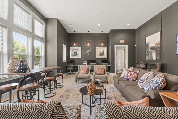 a living room with couches and chairs and a dining room table at The Ridge at Chenal Valley, Little Rock, AR 72223
