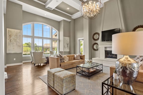 the living room has a fireplace and a large window at The Ridge at Chenal Valley, Little Rock, Arkansas