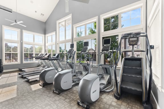 a gym with cardio equipment and windows at The Ridge at Chenal Valley, Little Rock, 72223