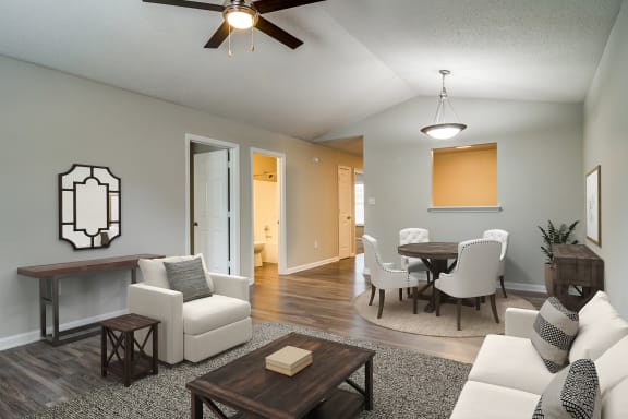 an open living room and dining room with a table and chairs  at Serene at Creekstone, Georgia, 30601