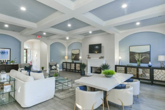 a living room with couches and chairs and a table