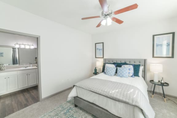a bedroom with a bed and a ceiling fan at The Shallowford, Chattanooga, Tennessee