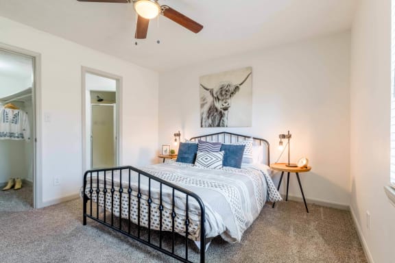 a bedroom with a bed and a ceiling fan at The Waters at Chenal, Arkansas, 72211