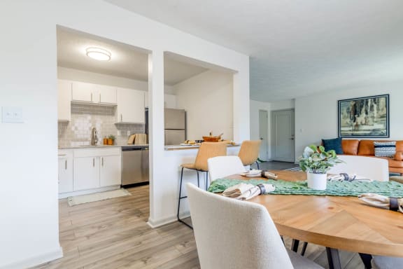 a dining room and kitchen with a table and chairs at The Waters at Chenal, Little Rock, Arkansas