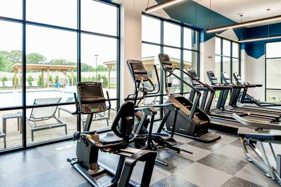 A gym with treadmills and exercise equipment.