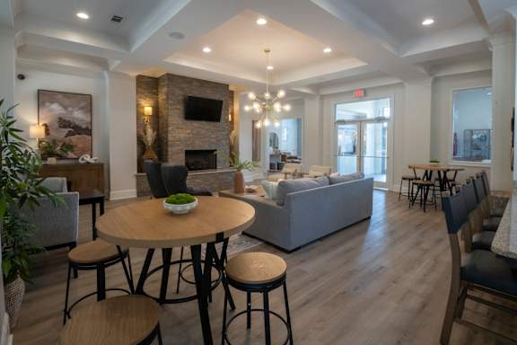 A living room with a fireplace and a couch. at Hall Creek Apartment Homes, Arlington, TN, 38002