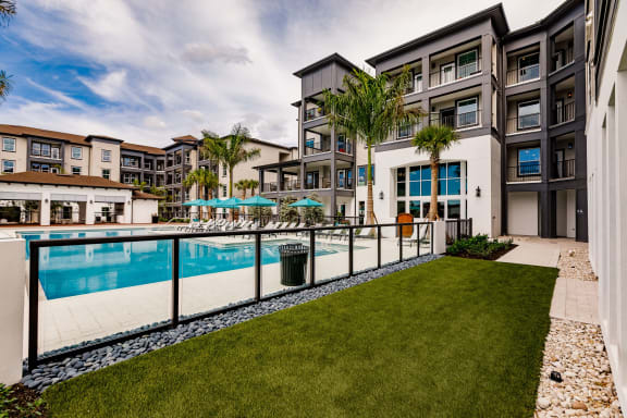 Side yard at the pool at Harrison Apartments, Florida, 34243