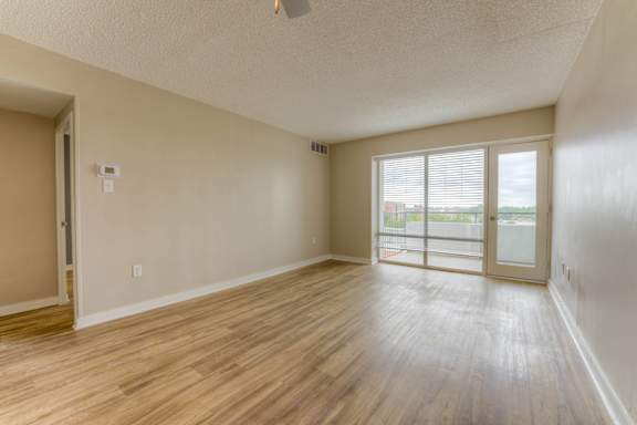 A room with wooden flooring and a ceiling fan.at Iris Luxury Apartments, Memphis Tennessee