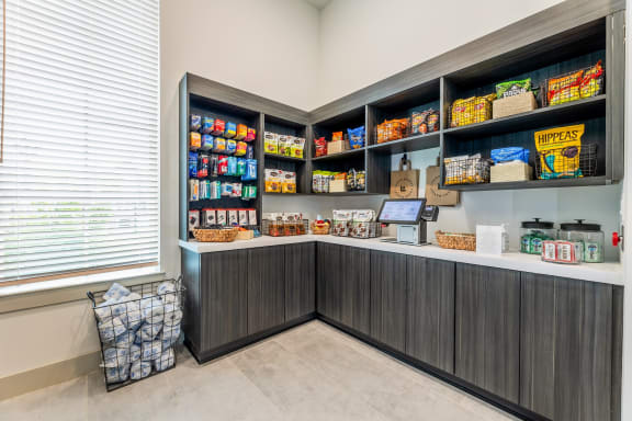 a pantry with a counter and shelves full of food  at The Livano Kemah, Kemah, 77565