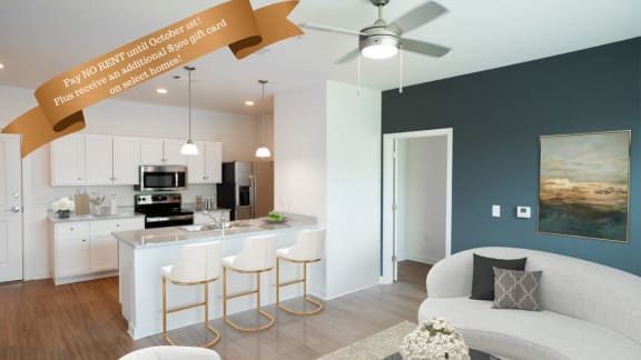 an open floor plan with a kitchen and living room