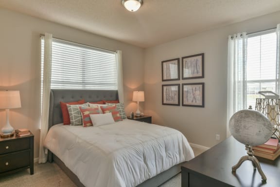 a bedroom with a bed and a dresser and a window at Legacy Farm, Tennessee, 38017