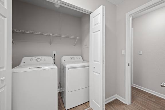 small laundry room with washer and dryer. at Manchester at Mansell, Roswell