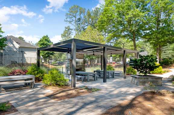 park with benches, and trees at Manchester at Mansell, Georgia ,30076