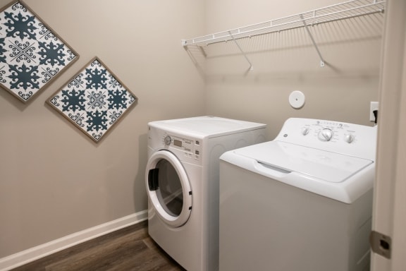 a washer and dryer in a laundry room at Meridian Park in Collierville, TN 38017