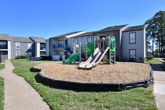 Playground with slide at Normandy Woods in Riviera East, Houston, TX, 77015