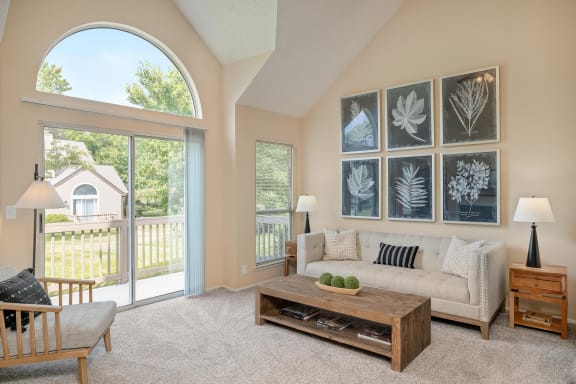 Living Room With Private Balcony at Pointe Royal, Overland Park