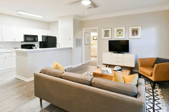 Spacious Living Room with 9' Ceilings with Crown Molding  at Polos at Hudson Corners Apartments, South Carolina 29650