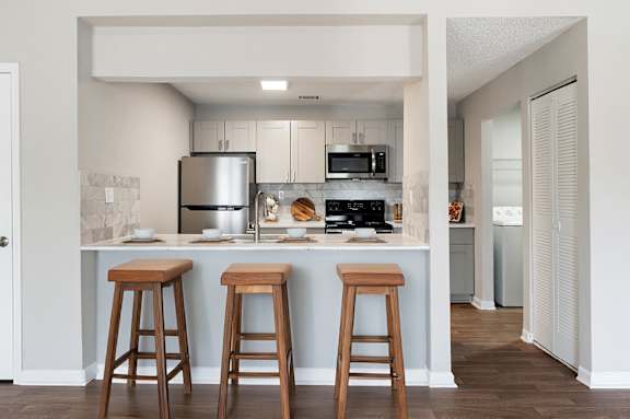 kitchen with wooden bar stools at Station Heights, Alpharetta, GA
