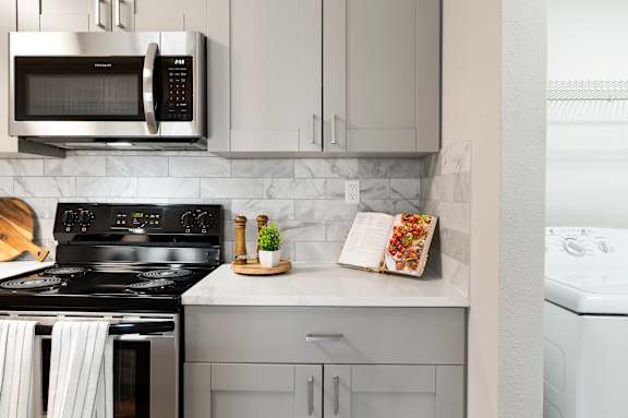 modern kitchen with silver color cabinet at Station Heights, Georgia