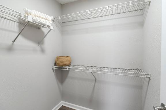 A white shelf with a brown bag on it. at Station Heights, Alpharetta, GA 30022